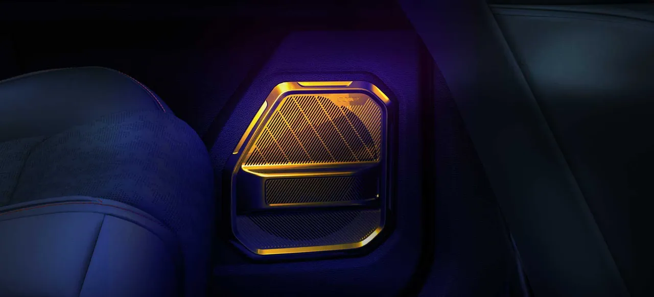 Door speaker grille glowing amber